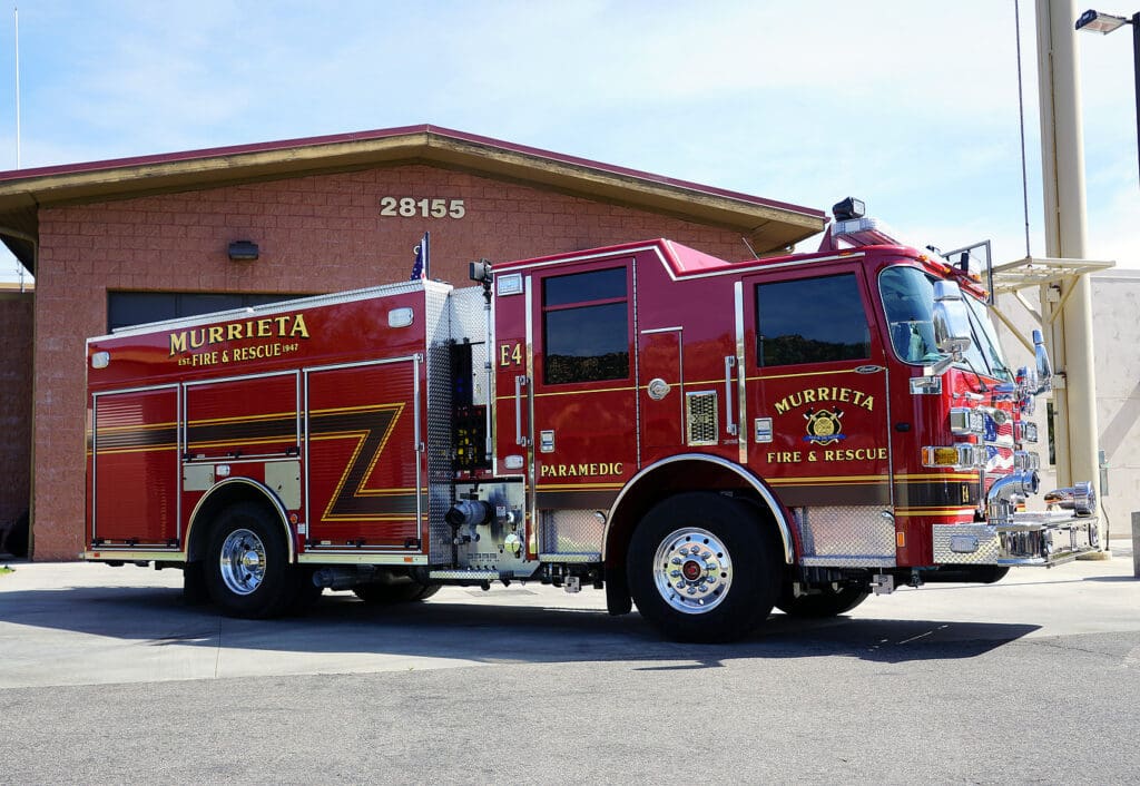A Murrieta Fire and Rescue fire engine parked on a street.