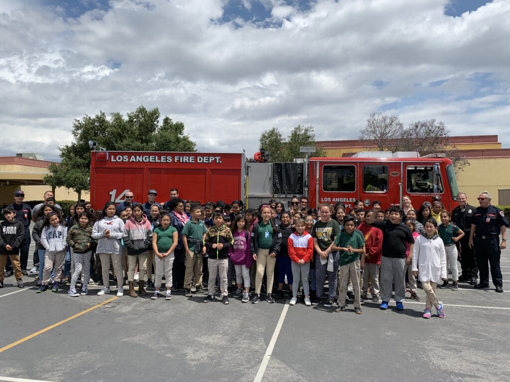 School children in front of Los Angeles Fire Department fire engine.