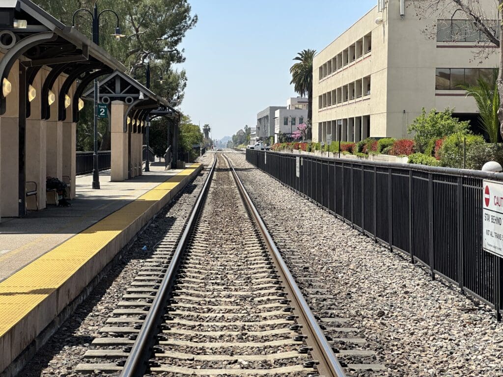 Empty train tracks on a sunny day.
