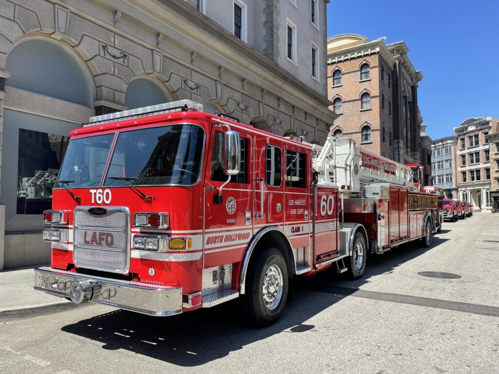 A LAFD fire engine parked outside a city building.